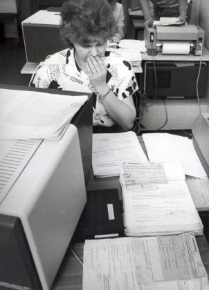 Flood of applications in a bank branch following monetary union, June 1990.