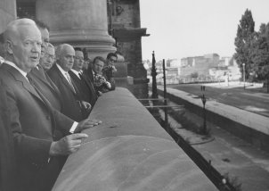 West German President Heinrich Lübke and the Ruling Mayor of Berlin, Willi Brandt, look down from the Reichstag at the barriers on the sector border, 30 August 1961