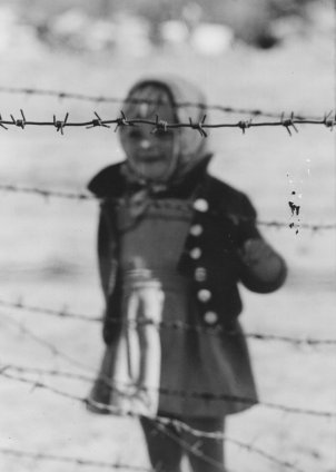 East Berlin child behind barbed wire – Berlin, September 1961