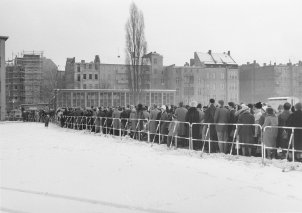 Queues of people waiting for border passes in front of a West Berlin school, December 1963