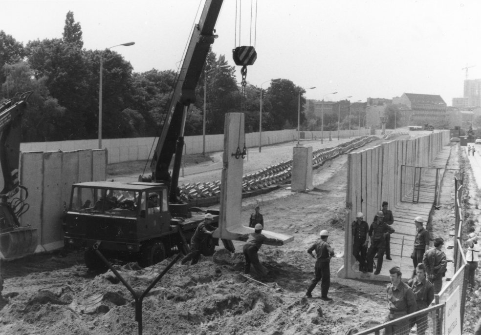 Construction of a new wall with pre-fabricated elements on Bernauer Strasse (taken 7 July 1980)