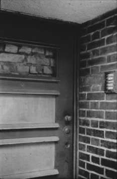 Walled-up door of an East Berlin house on the sector border between Treptow and Neukölln