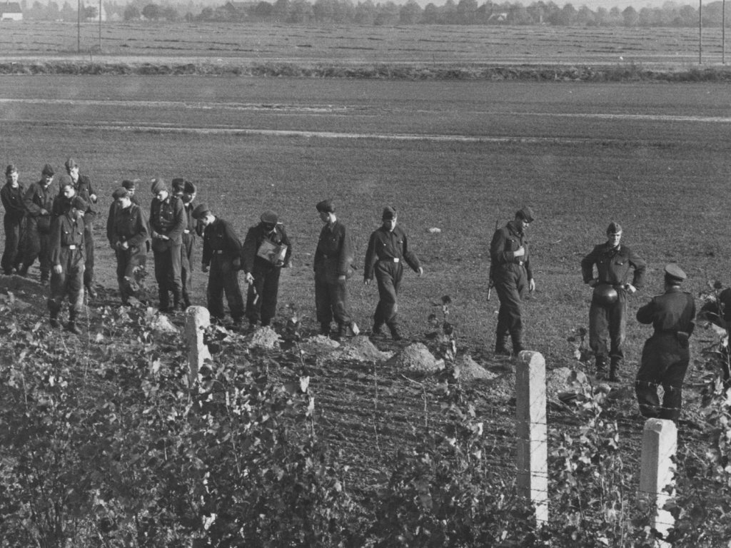 Border police place explosives in the "death strip" in West Berlin (Neukölln) to make trenches, 24 October 1961
