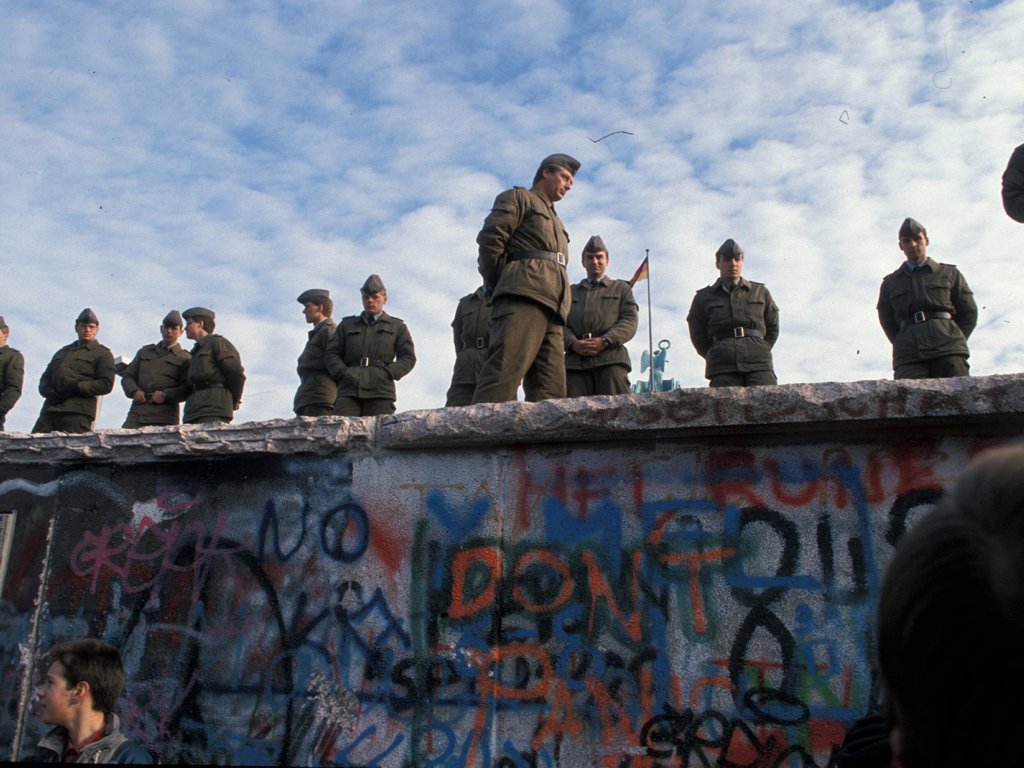 GDR border guards on the top of the Wall at the Brandenburg Gate on the morning of 11 November 1989