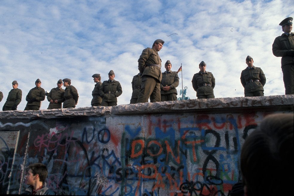 GDR border guards on the top of the Wall at the Brandenburg Gate on the morning of 11 November 1989