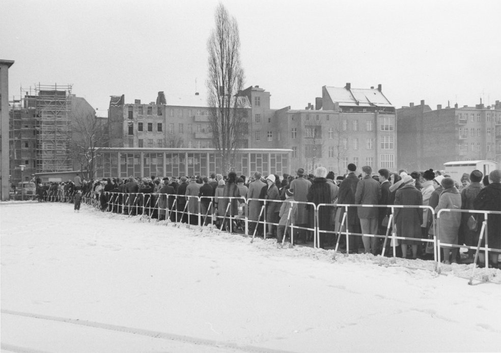 Queues of people waiting for border passes in front of a West Berlin school, December 1963