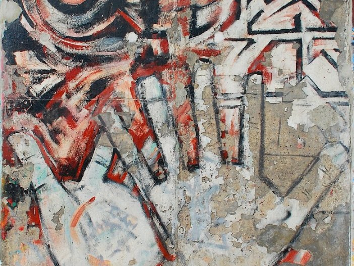 "Hands" by Margaret Hunter and Peter Russell along the East Side Gallery, 2009 The lower parts of the weathered painting on conrete shows the outline of two overlapping hands with outstreched fingers reaching upwards. In the upper portion of the painting, one sees geometric patterns.