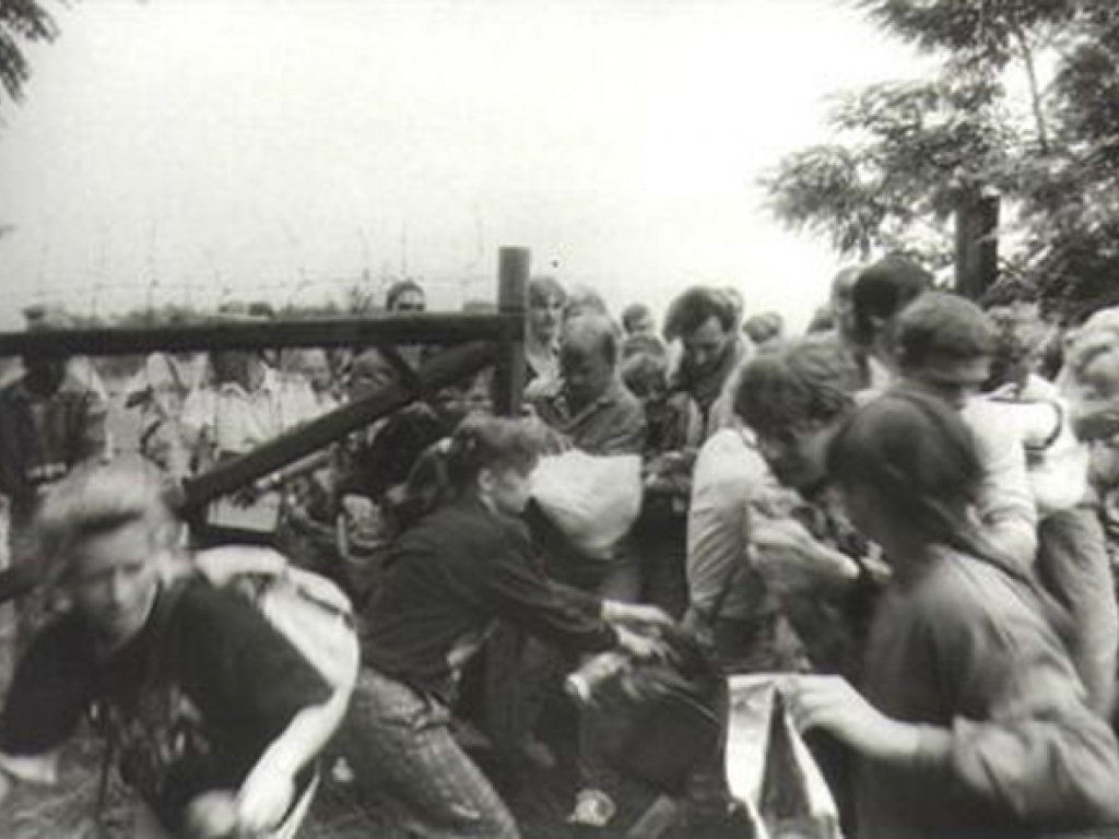 GDR citizens rush a border gate to Austria in Sopron