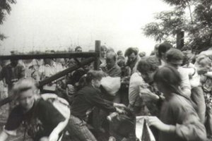 GDR citizens rush a border gate to Austria in Sopron