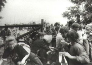 GDR citizens rush a border gate to Austria in Sopron