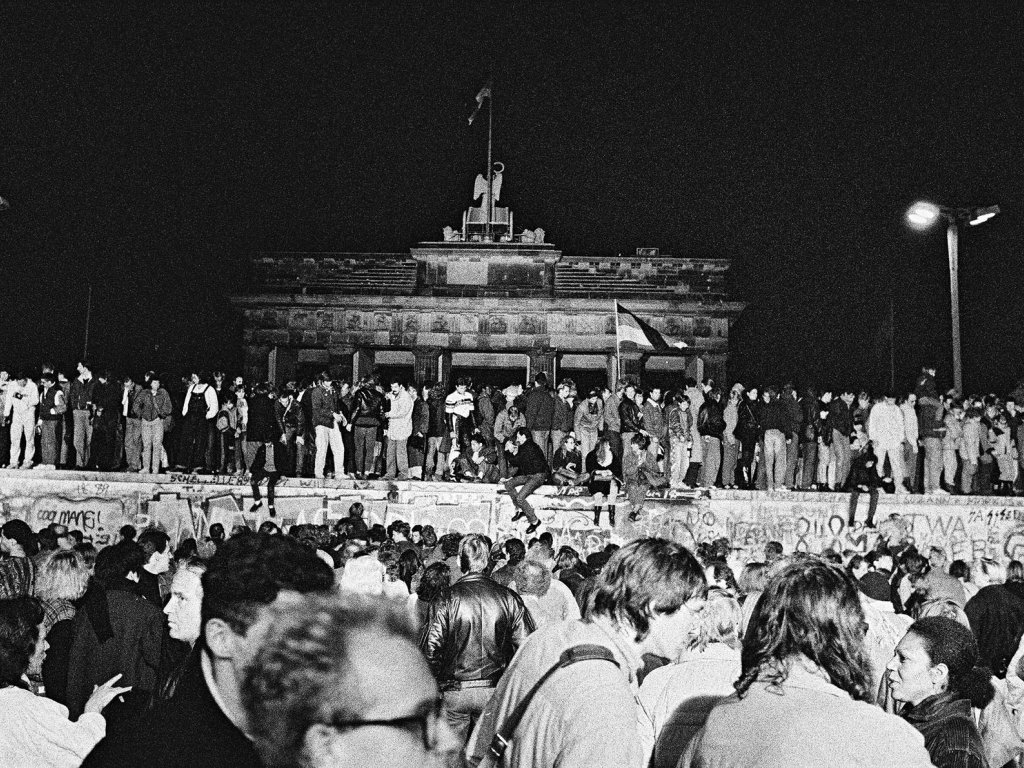 West and East Berliners on the top of the Brandenburg Gate.