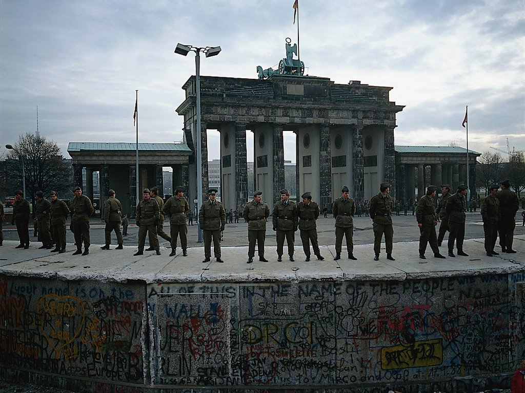 Border soldiers of the GDR have occupied the anti-tank wall to prevent people climbing it, 11 November 1989