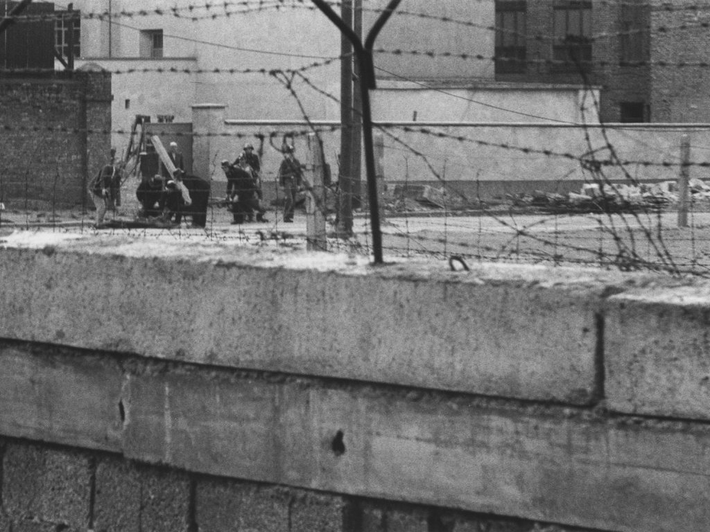 Reinhold Huhn, shot dead at the Berlin Wall: West Berlin police photo of the dead man being carried off [June 18, 1962]