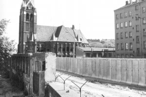 Wall in Bernauer Strasse with the Church of Reconciliation (Versöhnungskirche) in the background (taken 7 July 1980)