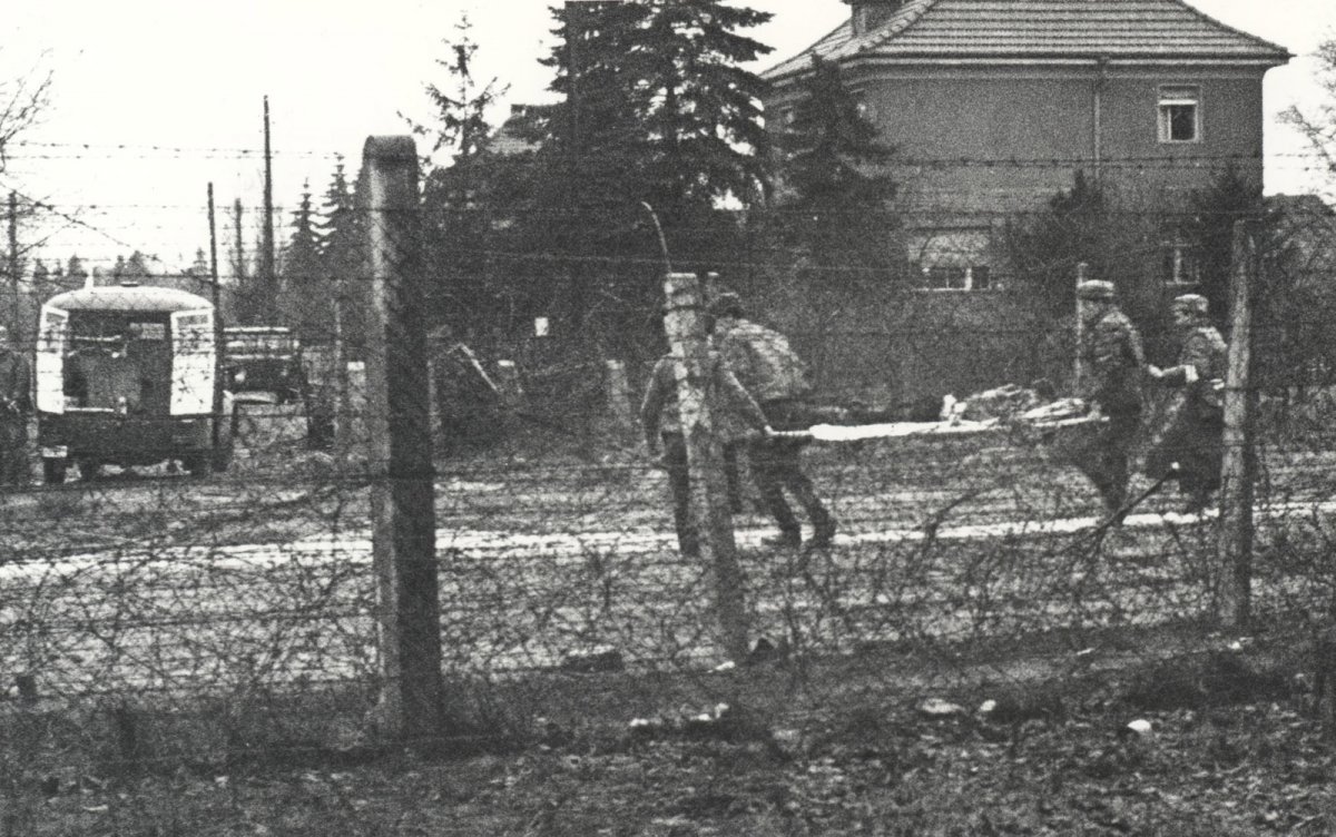 Willi Block, shot dead at the Berlin Wall: Removing the dead man from the death strip [West Berlin police photo, Feb.7, 1966]