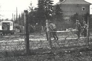 Willi Block, shot dead at the Berlin Wall: Removing the dead man from the death strip [West Berlin police photo, Feb.7, 1966]